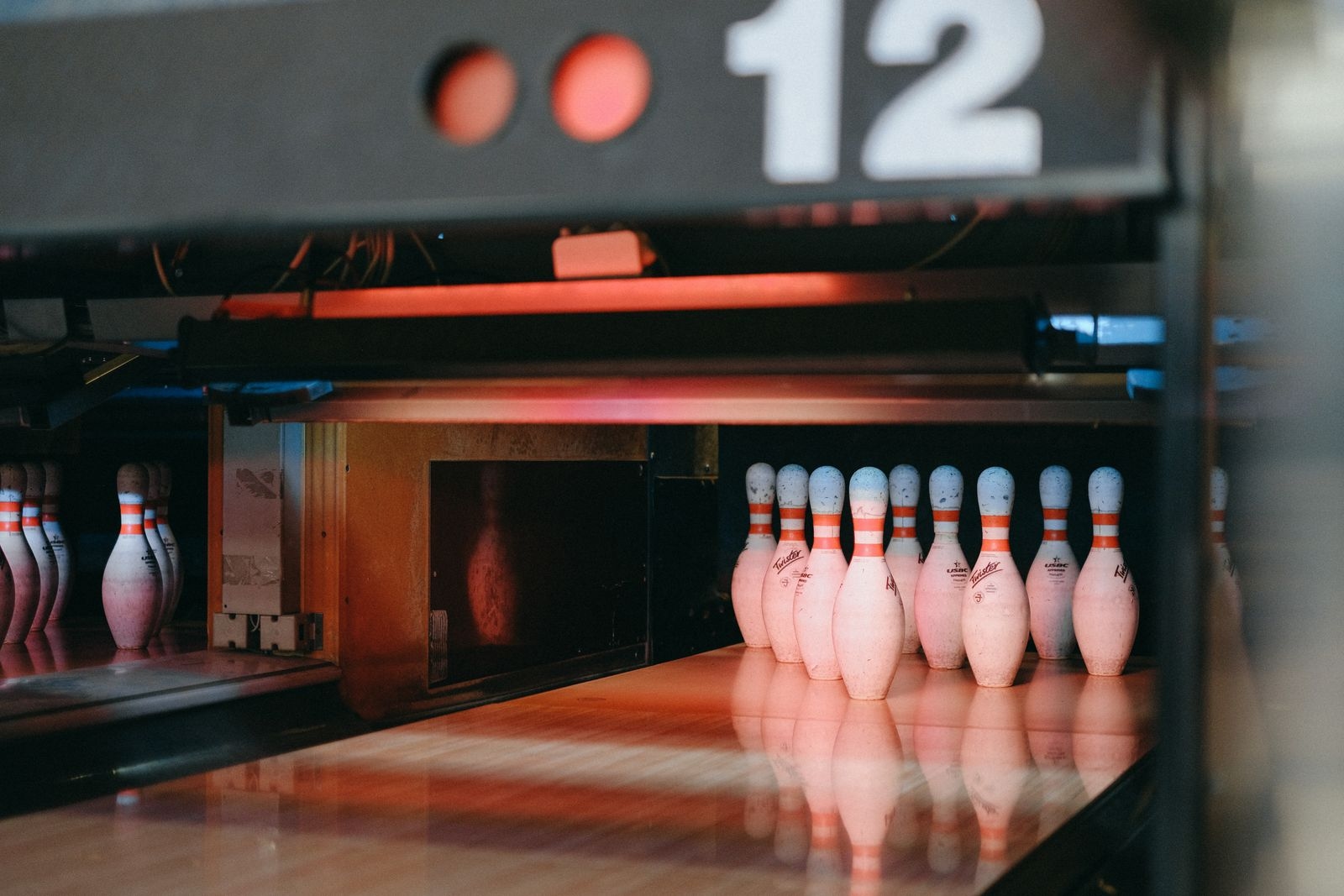 Bowling pins washed in red light