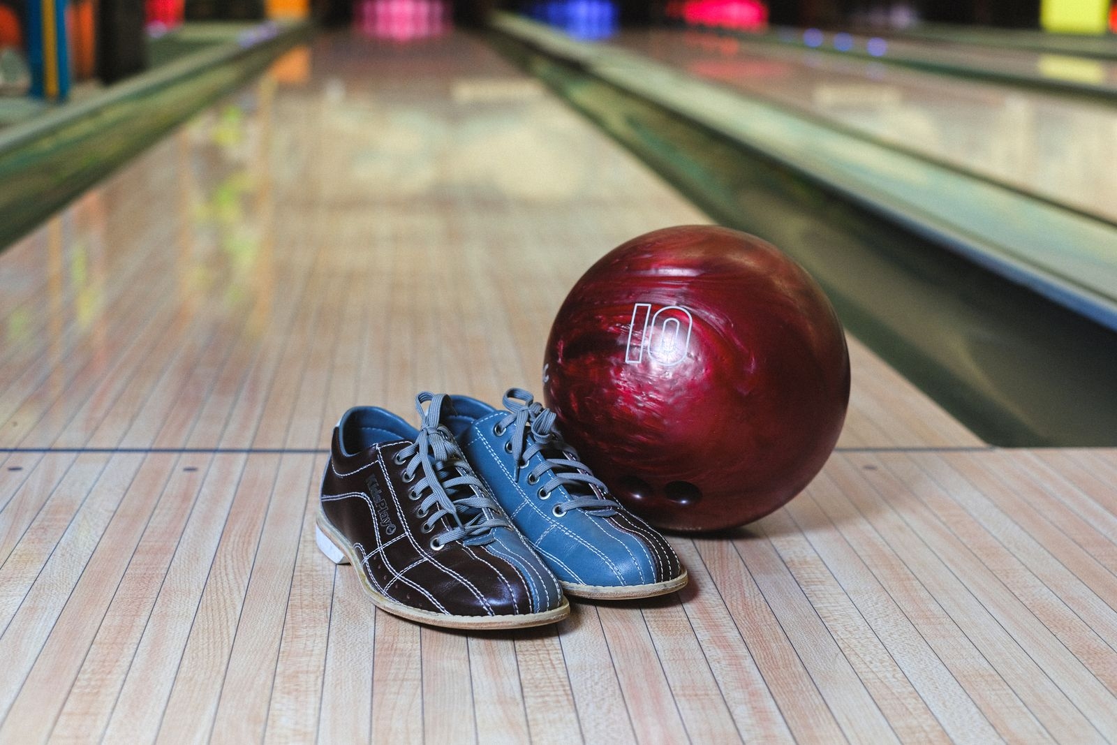 Bowling ball and shoes on the lane